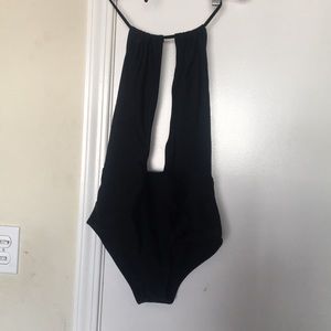 Plunging black one piece swimsuit
